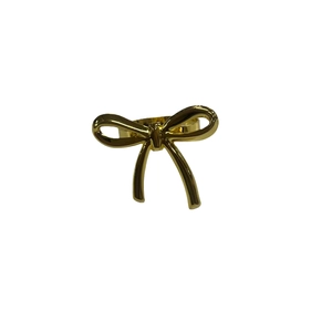 Elegant gold bow-shaped metal napkin ring with a polished mirror finish for table decor