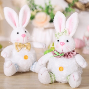 Pair of plush Easter bunny dolls with plaid bow ties and floral neck ruffles for party decor