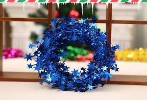 Detail of 7.5m blue metallic PVC star tinsel garland for Christmas tree decoration