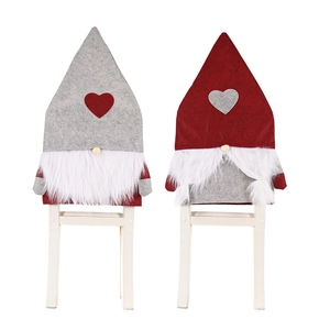 Christmas gnome chair covers with red and grey heart patterns and plush white beards