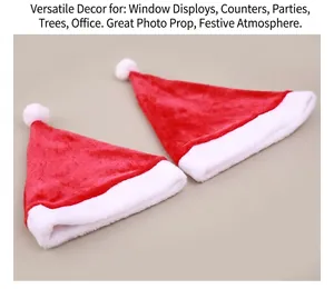 Detail view of two premium red plush Christmas hats with white trim on burlap background