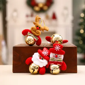 Detailed view of Christmas bells with plush Santa, Snowman and Reindeer figurines