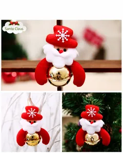 Detail of Santa Claus ornament with red snowflake hat and golden metal bell for Christmas tree