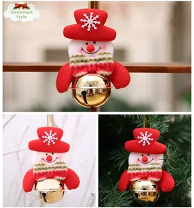Detail of Christmas snowman bell ornament with red hat and golden star cutout bell