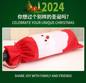 Detail of red Santa Claus wine bottle cover with drawstring for Christmas table decor