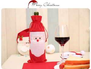 Detail of red Santa Claus wine bottle cover with 3D decoration and festive drawstring