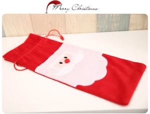 Detailed plush Santa wine bottle gift bag with 3D beard and red drawstring closure