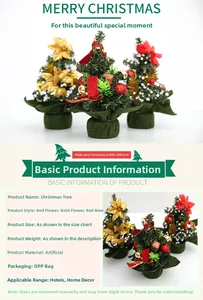 Detailed view of three 20cm mini Christmas trees with red berries and golden flowers