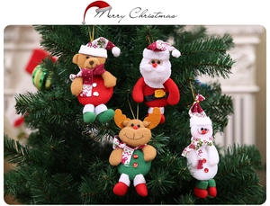 Detailed plush ornaments featuring Santa Claus, reindeer, and snowman on a Christmas tree
