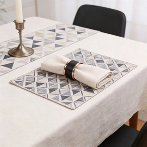 Detail of Nordic dining set showing geometric triangle patterns on table runner and mat