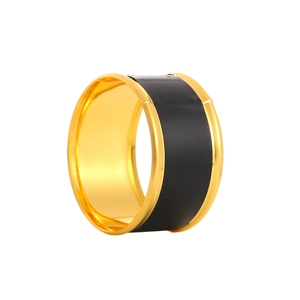 Elegant gold napkin ring with black matte enamel inlay for luxury table settings