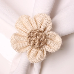 Close-up of rustic jute sunflower napkin ring with detailed hand-woven petals