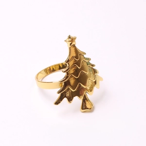 Elegant gold Christmas tree napkin ring with polished metal finish for holiday table decor