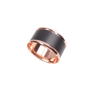 Modern black and rose gold napkin ring with sleek metallic edges in Nordic style