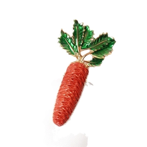 Creative orange carrot napkin ring with green leaves and gold edges for Thanksgiving decor