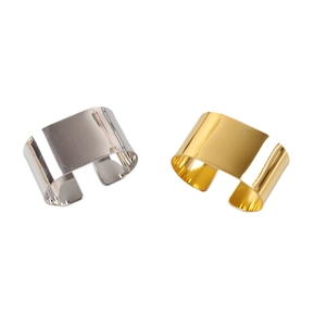 Modern gold and silver C-shaped napkin rings with a high-polished metallic finish