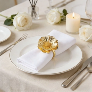 Elegant gold flower napkin ring with layered daisy petals for luxury hotel table setting