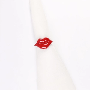 Creative red lip shaped zinc alloy napkin ring for festive table decoration on white background