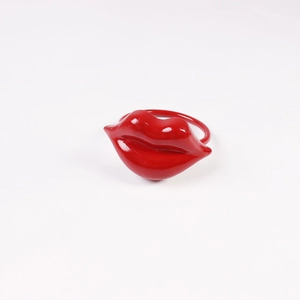 Detail showing high-gloss red lip shaped creative zinc alloy ring with smooth finish