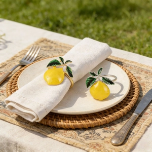 Lemon napkin rings with yellow enamel and green leaves on gold metal base, set of 2