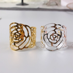 Golden and silver metal napkin rings with hollow rose flower design for wedding decor