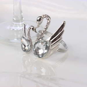 Elegant silver swan napkin rings with sparkling rhinestones for luxury wedding table decor