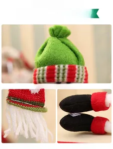 Detail of Christmas wine bottle cover showing festive hat, scarf and velcro fastener