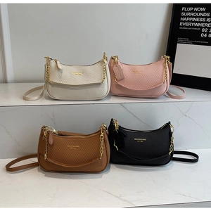 Collection of textured crescent underarm bags in four colors with gold chain straps