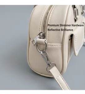 Close-up of cream white handbag with silver hardware and high-quality PU leather texture
