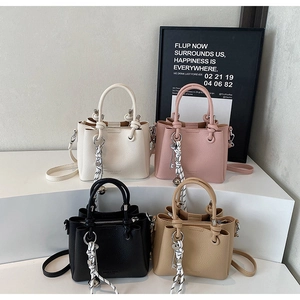 Litchi pattern leather bucket bags in four colors with braided cord and key pendant charms