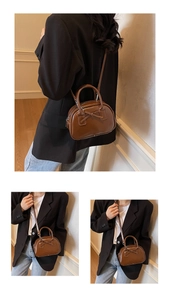 Detail of a brown oil wax leather bowling bag featuring a decorative bow and crossbody strap