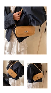 Detail of ginger rectangular shoulder bag featuring a silver metal twist lock and matte finish