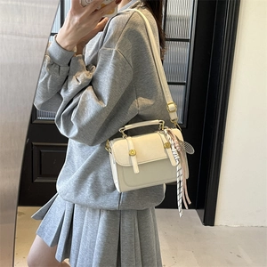 Vintage off-white frosted top-handle bag with scarf and tennis racket charm accessory