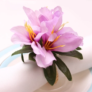 Macro detail of artificial lavender silk rose napkin ring with rustic rattan loop
