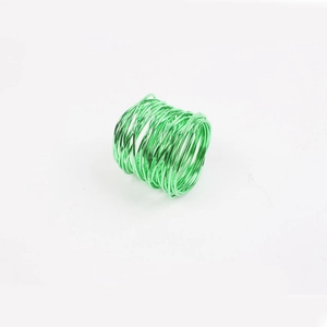 Detail of emerald green handmade wire wrap napkin ring with spiral metallic finish