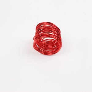 Handcrafted red wire napkin ring with decorative multi-loop design on white background