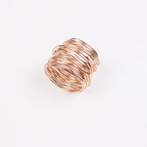 Rose gold handmade wire wrapped napkin ring set with a modern industrial minimalist design