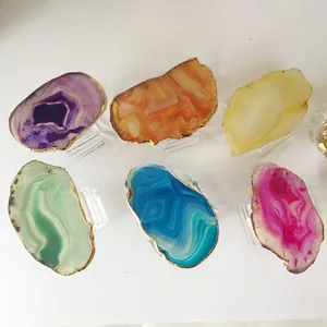 Detailed view of natural agate napkin rings with gold edges in six vibrant colors