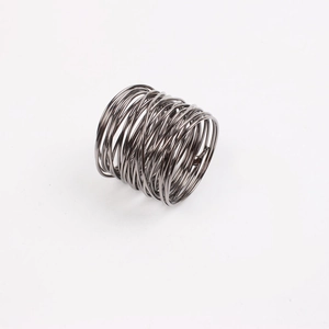 Macro shot of industrial style wire-wrapped napkin ring in gun black metal finish