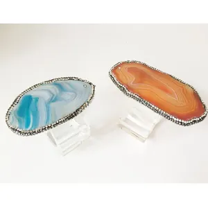 Detailed view of blue and orange agate napkin rings with crystal rhinestone edges