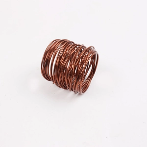 Detailed close-up of handmade bronze wire napkin ring with spiral wire craftsmanship