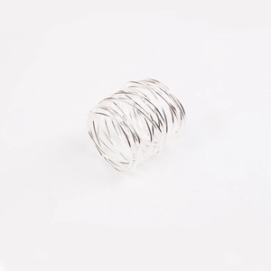 Macro shot of silver metal wire napkin ring featuring a spiral multi-layer wrap design