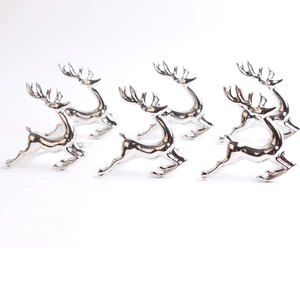 Detailed macro view of a set of 6 silver reindeer napkin rings for Christmas table decor