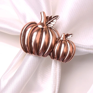Rose gold pumpkin napkin rings set with realistic leaf detail for Halloween table decor