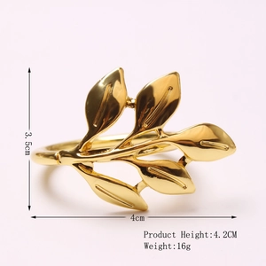 Detailed view of golden leaf napkin ring with 4.2cm height and 4cm width dimensions