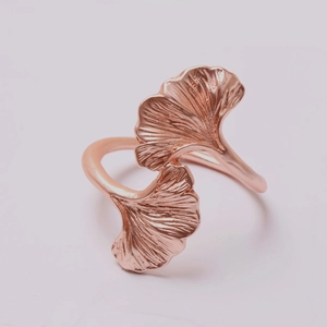 Detailed view of rose gold ginkgo leaf ring showing intricate textures on the twin leaves