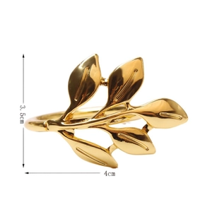 Golden five-leaf metal napkin ring measuring 3.5cm by 4cm for elegant table decor
