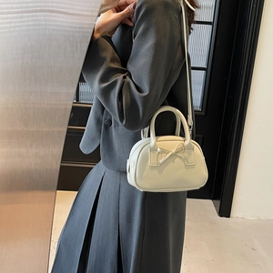 Chic beige bow-knot crossbody bowling bag with top handle and adjustable strap for women