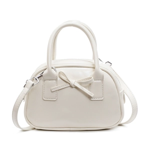 Elegant cream white bow bowling bag with dual handles and slim shoulder strap