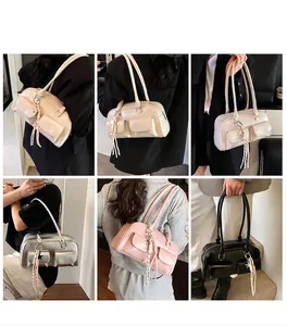 Detail showing vintage shoulder bags with double pockets and tassel charm in four colors